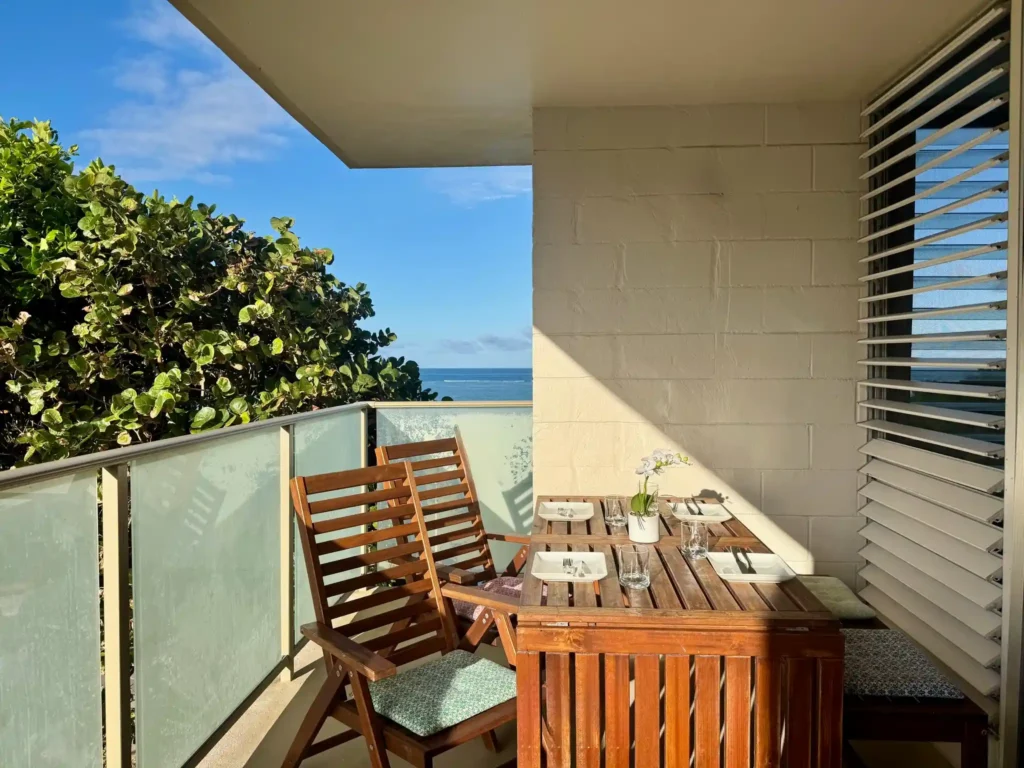 Oceanfront lanai dining area with Pacific Ocean view at a beachfront condo on Oahu’s North Shore, Hawaii.